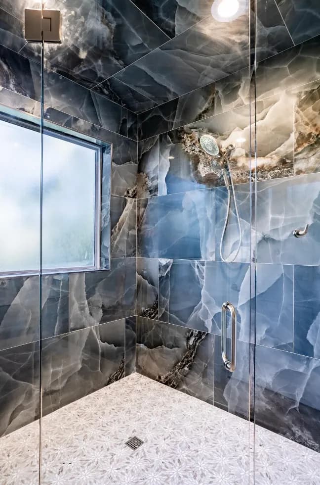 Blue onyx-look shower walls and ceiling with window